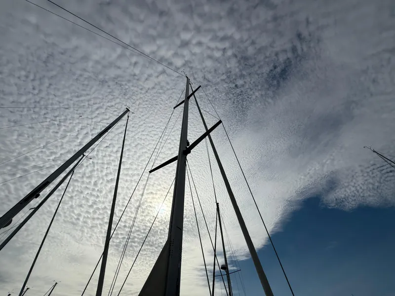 Slide: The Image of Sailboat masts against a cloudy sky, Catalina 309, 2007 model. - 32