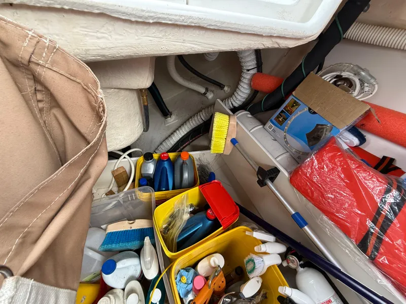 Slide: The Image of Storage area on a 2007 Catalina 309 boat with cleaning supplies and equipment. - 39