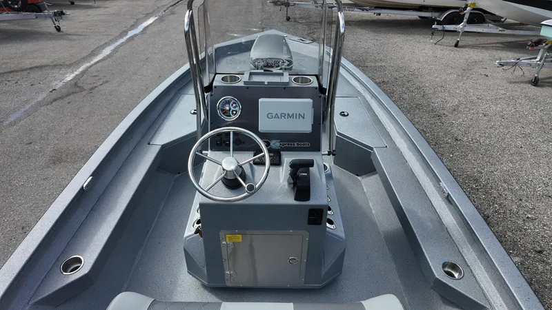 Slide: The Image of 2026 Xpress H20B boat interior with Garmin navigation system and steering console. - 15