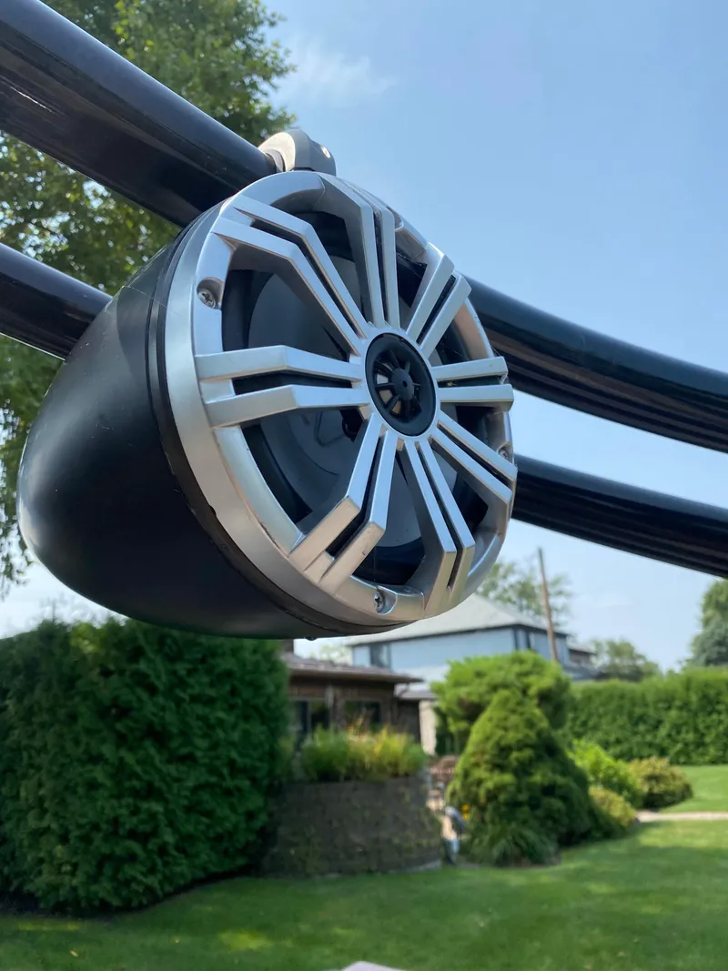 Slide: The Image of Close-up of a speaker on a 2018 Bennington 25 GCW boat, with greenery in the background. - 15