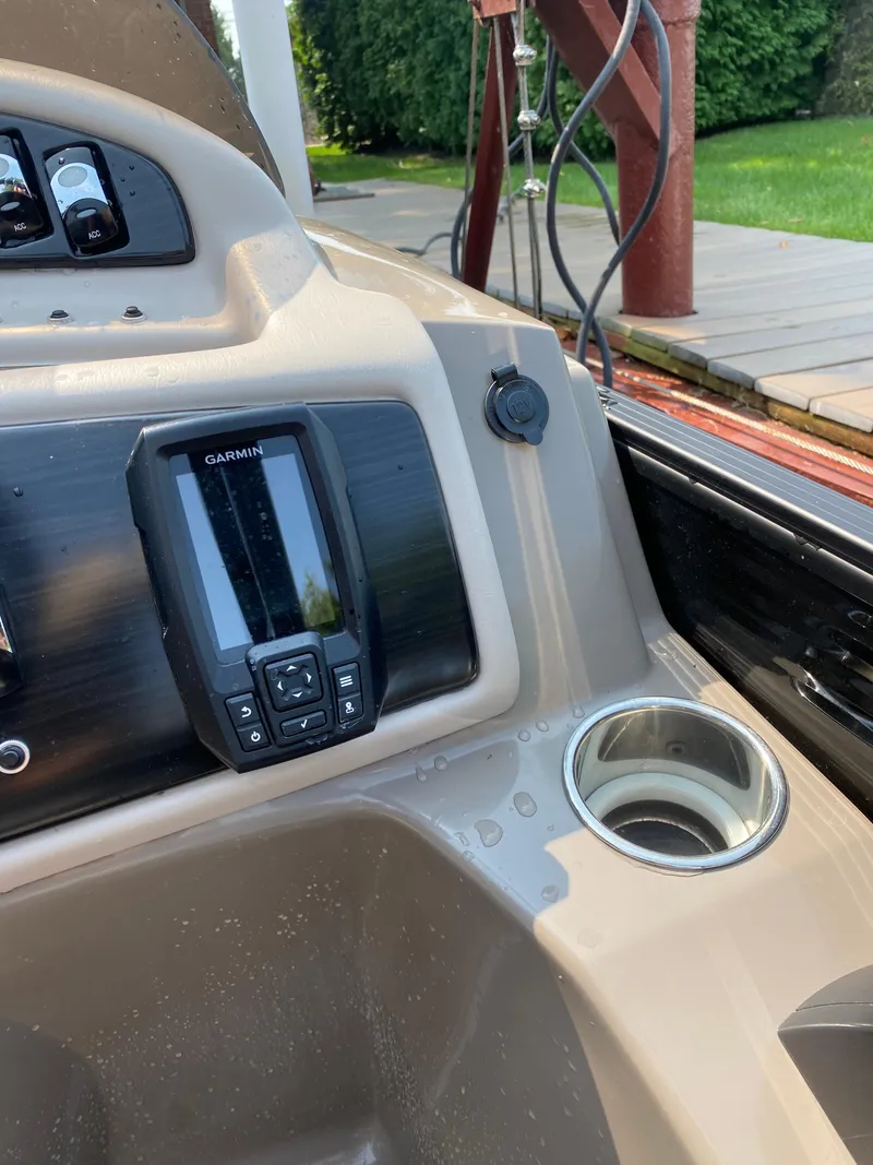 Slide: The Image of Control panel of a 2018 Bennington 25 GCW boat with Garmin display and cup holder. - 7