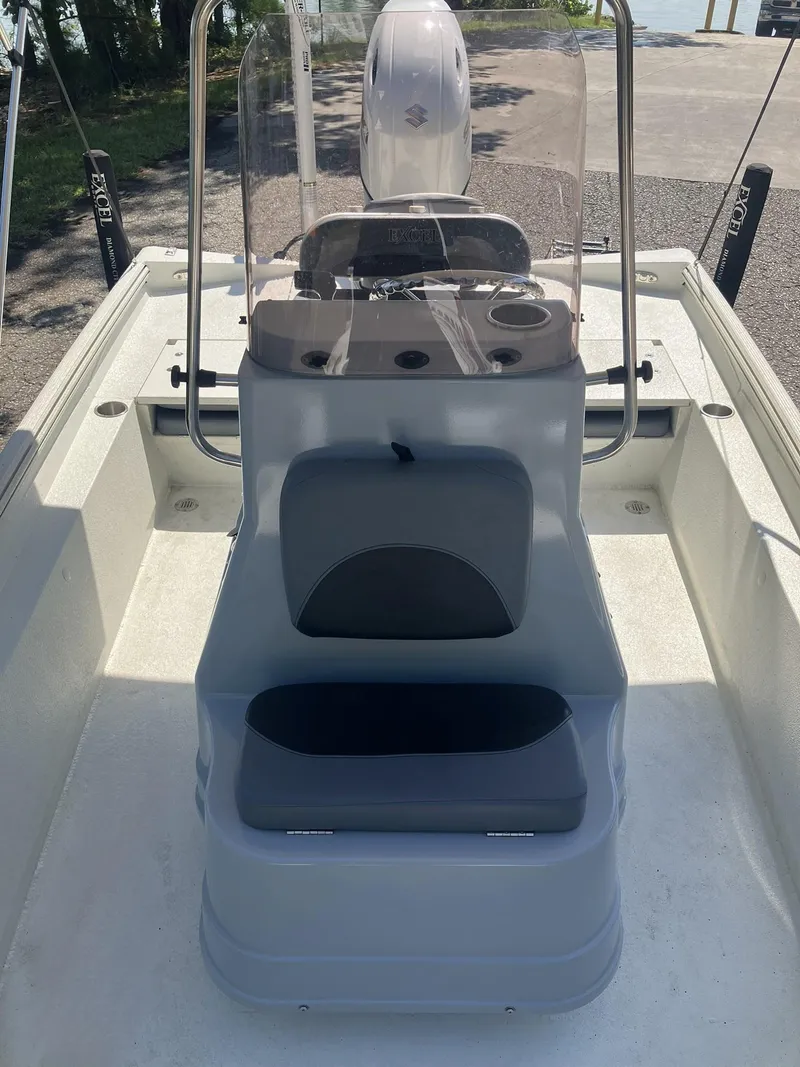 Slide: The Image of 2022 Excel 220 Bay Pro boat interior with console and seating. - 12