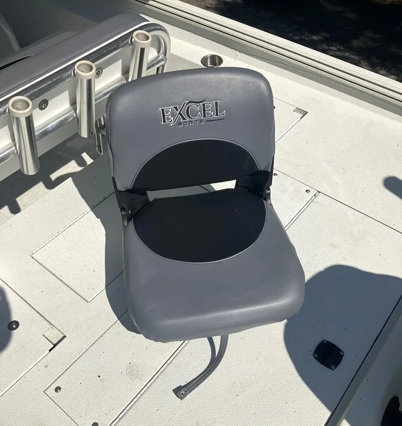 Slide: The Image of Gray boat seat on 2022 Excel 220 Bay Pro, featuring rod holders. - 21