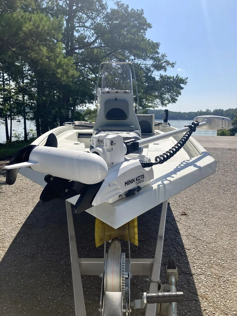 Slide: The Image of 2022 Excel 220 Bay Pro boat with Minn Kota trolling motor on trailer. - 5