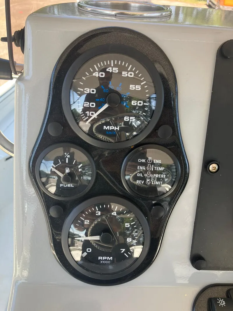 Slide: The Image of Dashboard of 2022 Excel 220 Bay Pro boat with speedometer and fuel gauges. - 8