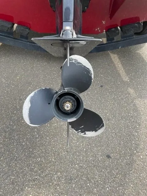 Slide: The Image of 2014 Tracker Targa V-18 Combo boat propeller with visible wear on blades. - 15