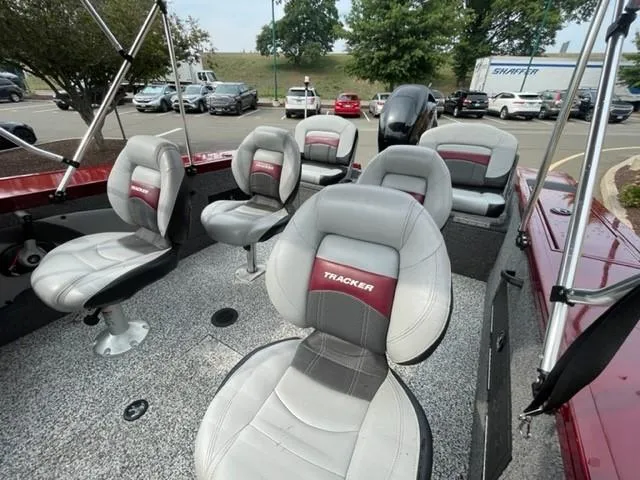 Slide: The Image of 2014 Tracker Targa V-18 Combo boat interior with multiple cushioned seats. - 6