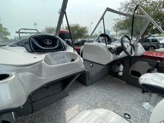 Slide: The Image of 2014 Tracker Targa V-18 Combo boat interior with dual consoles and seating. - 7