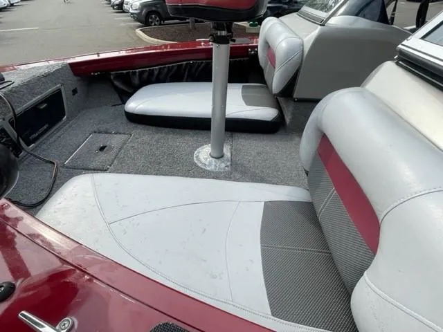 Slide: The Image of 2014 Tracker Targa V-18 Combo boat interior with red and gray seating. - 8
