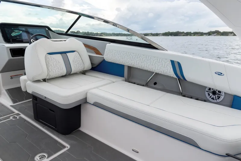 Slide: The Image of 2026 Regal LS9 Surf boat interior with luxurious white seating and modern dashboard. - 17