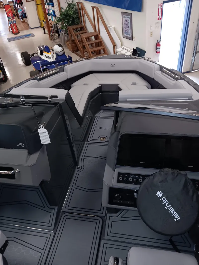Slide: The Image of 2026 Cobalt R4 Surf boat interior with modern seating and dashboard design. - 13