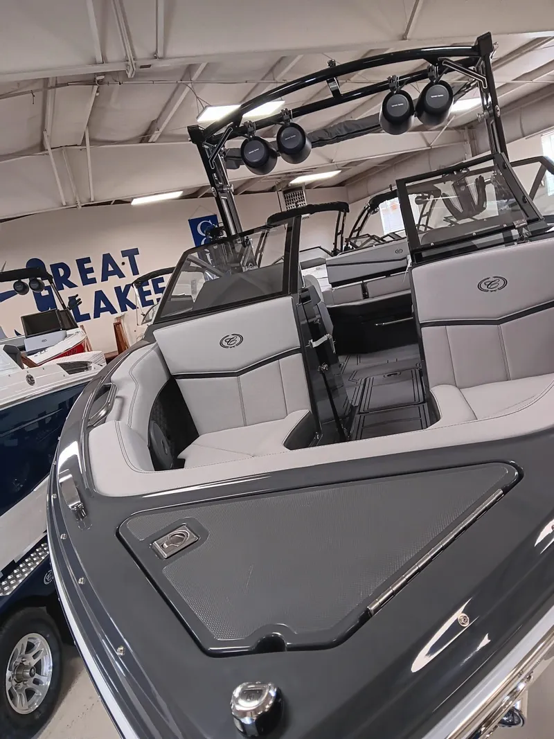 Slide: The Image of 2026 Cobalt R4 Surf boat interior with sleek seating and modern design in showroom. - 17