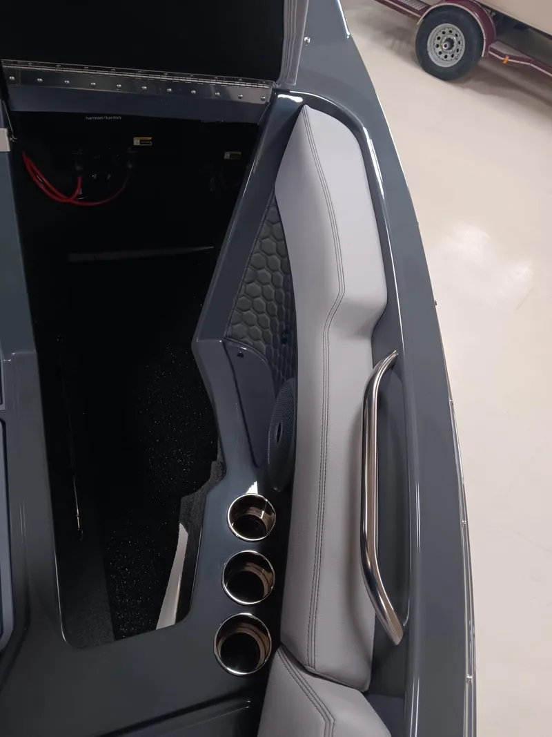 Slide: The Image of Interior of 2026 Cobalt R4 Surf boat with sleek seating and cup holders. - 8