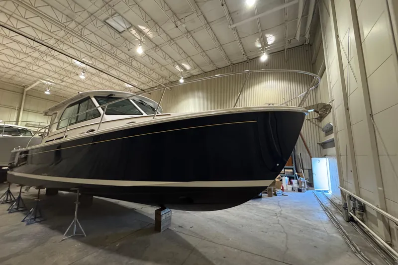 The Image of 2026 Back Cove 39O boat in a spacious indoor storage facility. - 0