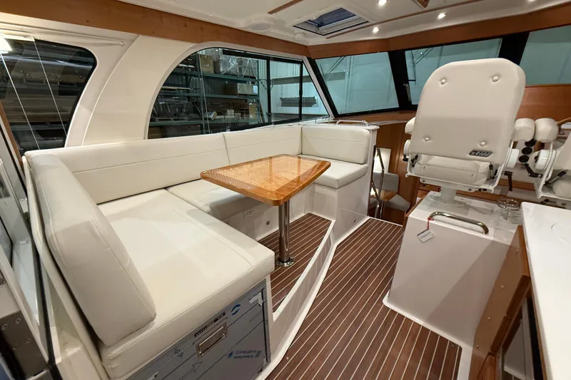 Slide: The Image of Luxurious interior of 2026 Back Cove 39O yacht with plush seating and elegant wood finishes. - 18