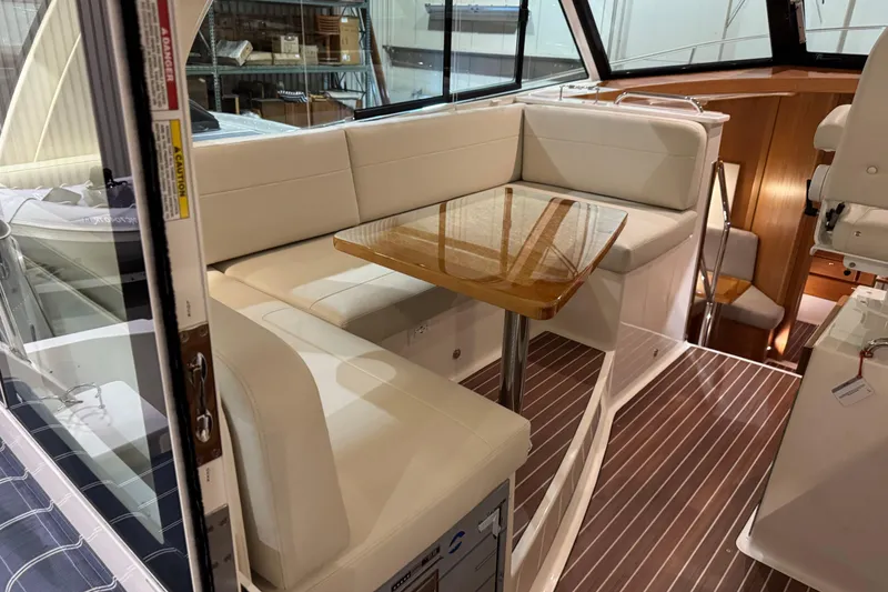 Slide: The Image of Luxurious interior of 2026 Back Cove 39O yacht with elegant seating and wooden table. - 19
