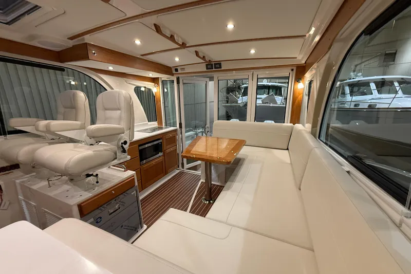 Slide: The Image of Luxurious interior of 2026 Back Cove 39O yacht with plush seating and modern amenities. - 23