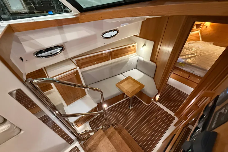 Slide: The Image of Luxurious interior of 2026 Back Cove 39O yacht with cozy seating and elegant wood finishes. - 27