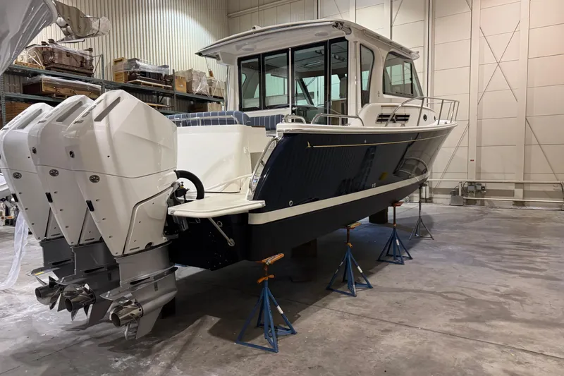 Slide: The Image of 2026 Back Cove 39O boat in a spacious indoor storage facility. - 3