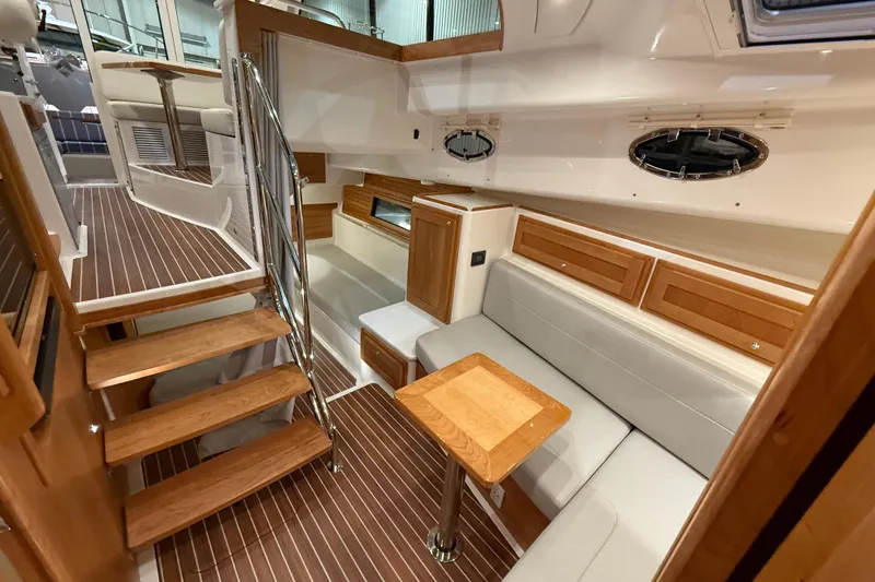 Slide: The Image of 2026 Back Cove 39O yacht interior with wooden stairs, seating, and elegant cabinetry. - 30