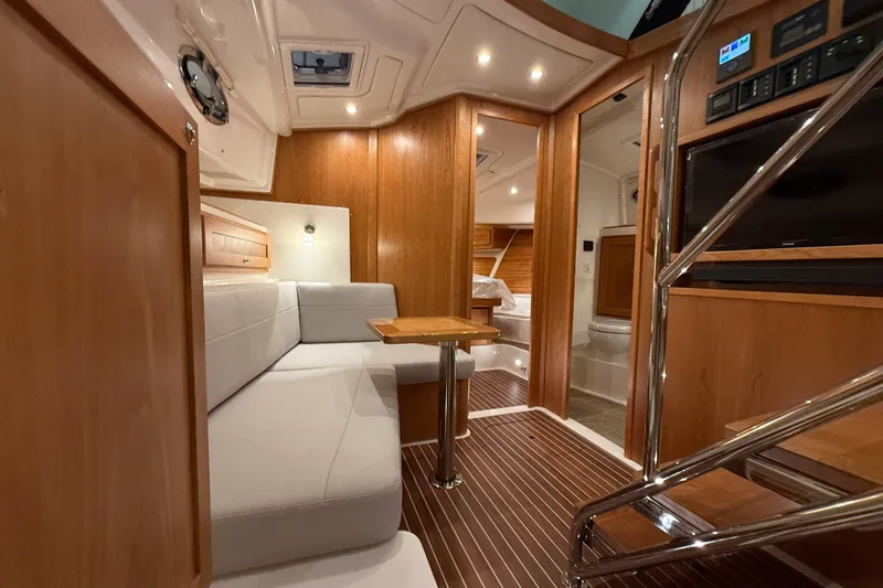Slide: The Image of Luxurious interior of 2026 Back Cove 39O yacht with modern wood finishes and cozy seating. - 33