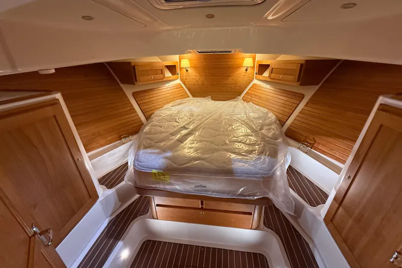 Slide: The Image of Luxurious cabin interior of 2026 Back Cove 39O yacht with wood paneling and cozy lighting. - 35