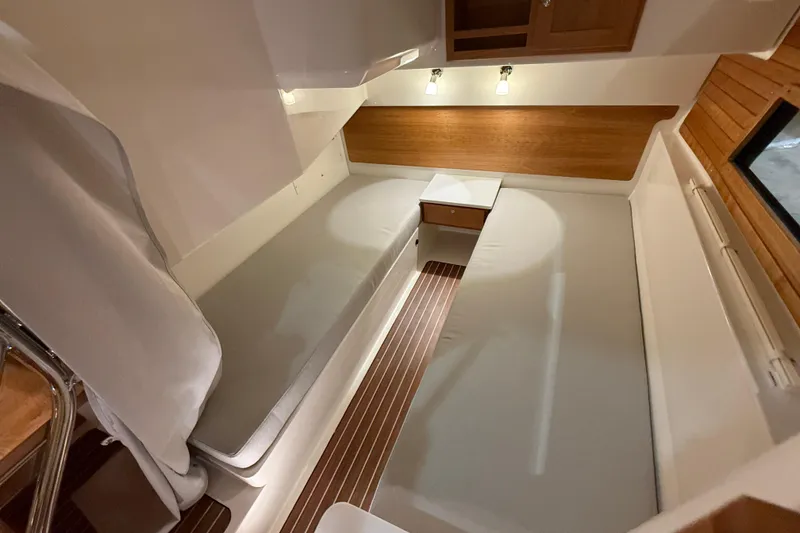 Slide: The Image of 2026 Back Cove 39O cabin interior with modern design and wooden accents. - 40