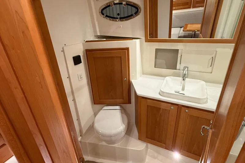 Slide: The Image of Luxurious bathroom in 2026 Back Cove 39O yacht with wooden cabinetry and modern fixtures. - 41