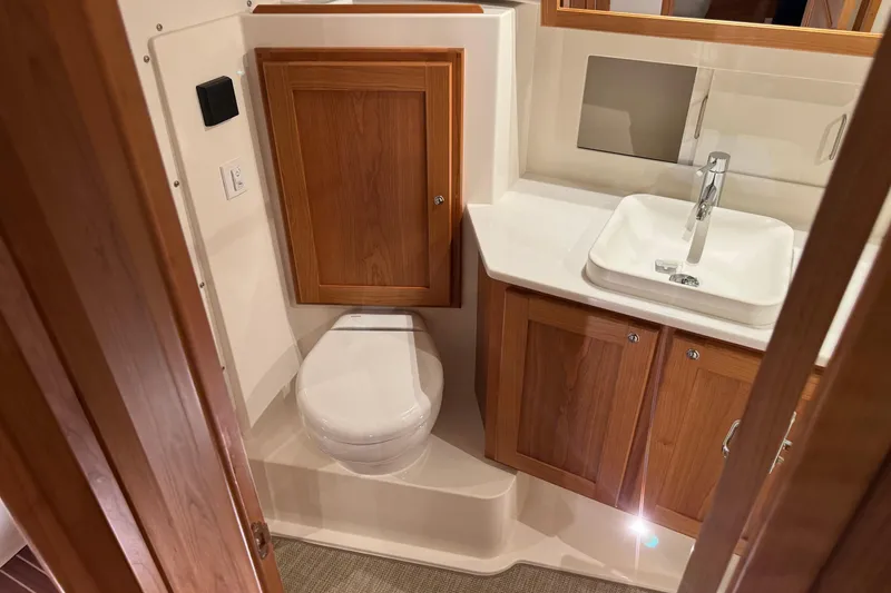 Slide: The Image of Bathroom interior of 2026 Back Cove 39O yacht with wooden cabinetry and modern fixtures. - 42