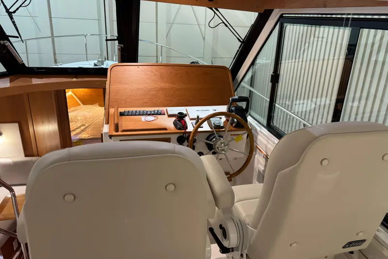 Slide: The Image of 2026 Back Cove 39O boat in a spacious indoor storage facility. - 8