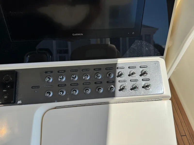 Slide: The Image of Control panel of a 2011 Scout 345 XSF boat with Garmin display. - 18