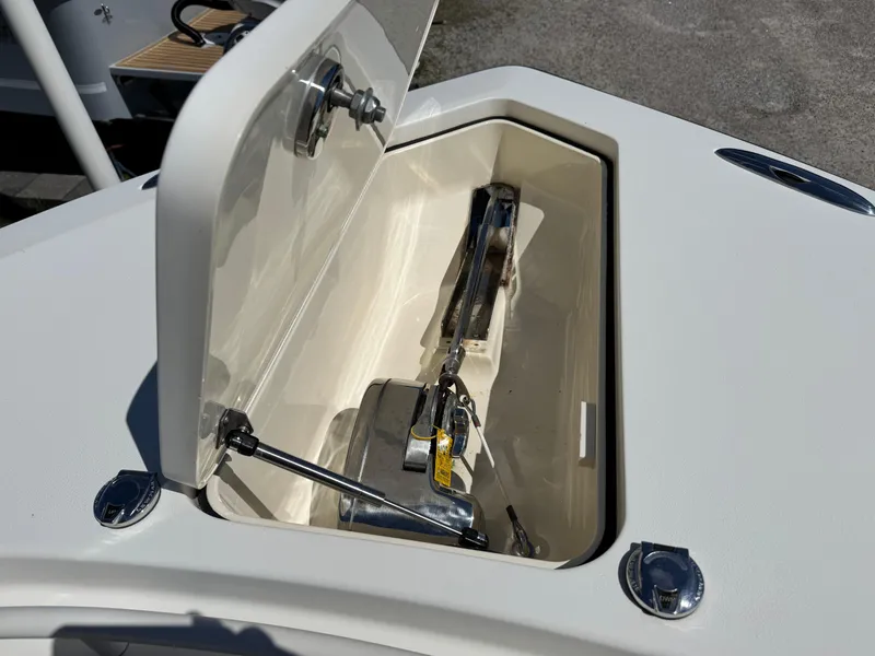 Slide: The Image of Open storage compartment on 2011 Scout 345 XSF boat, showing interior details. - 24