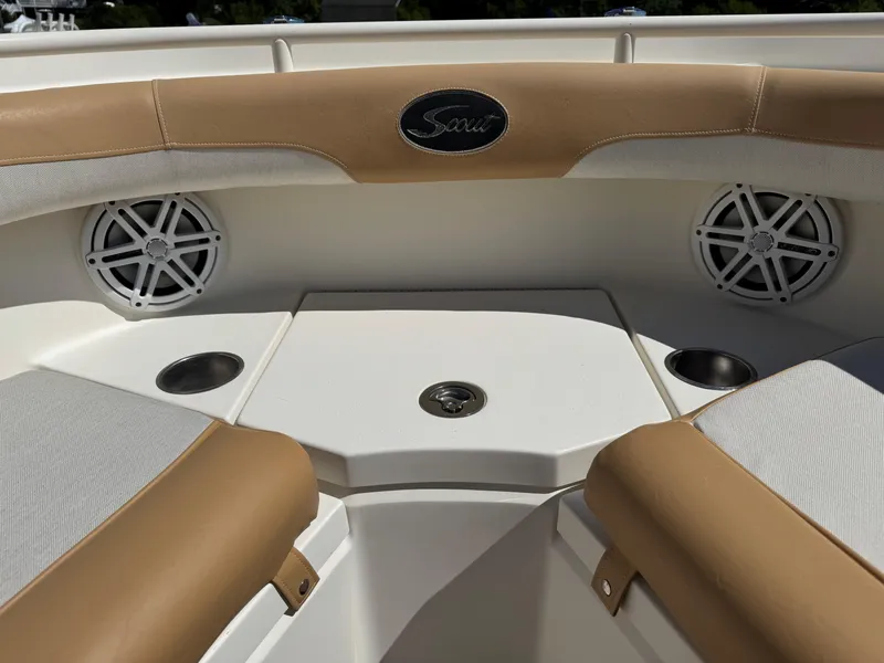 Slide: The Image of 2011 Scout 345 XSF boat interior with speakers and cup holders. - 26