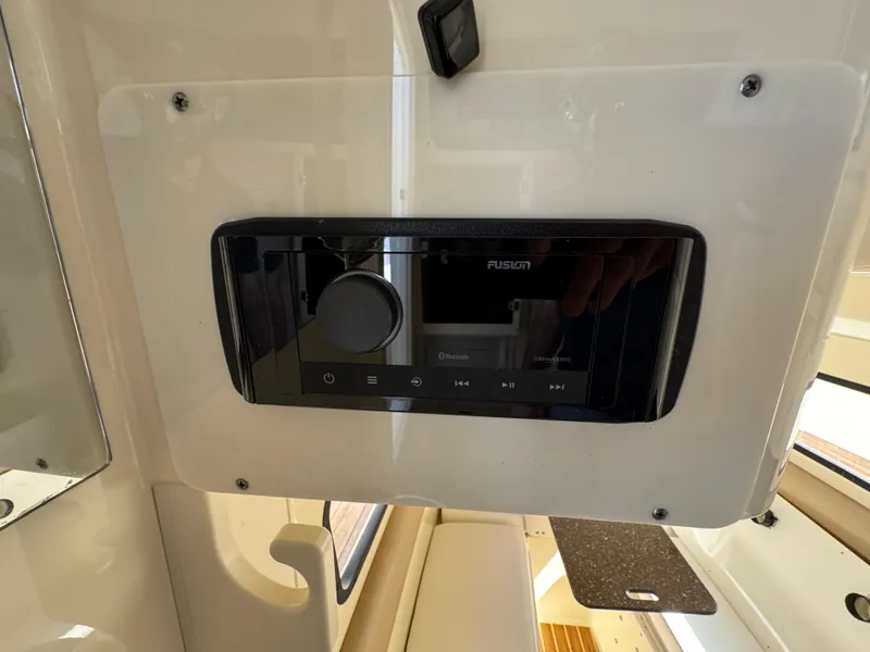 Slide: The Image of Fusion audio system on a 2011 Scout 345 XSF boat dashboard. - 29