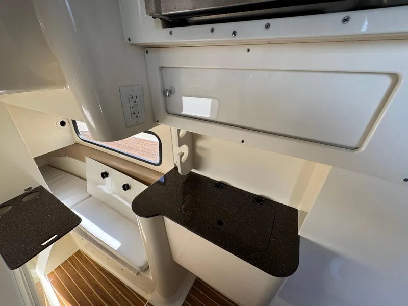 Slide: The Image of Interior of 2011 Scout 345 XSF boat with sleek cabinetry and seating area. - 30