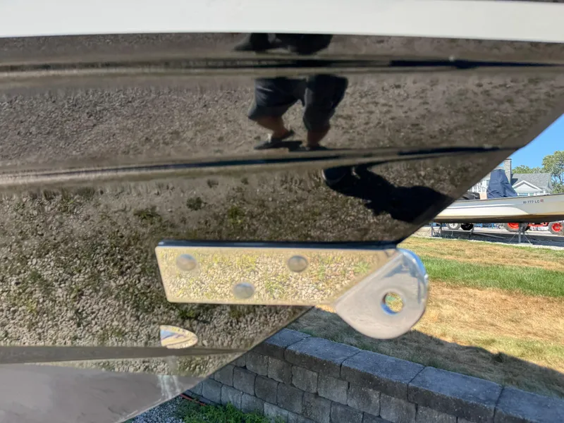 Slide: The Image of 2011 Scout 345 XSF boat hull with metal fitting, outdoor setting. - 8