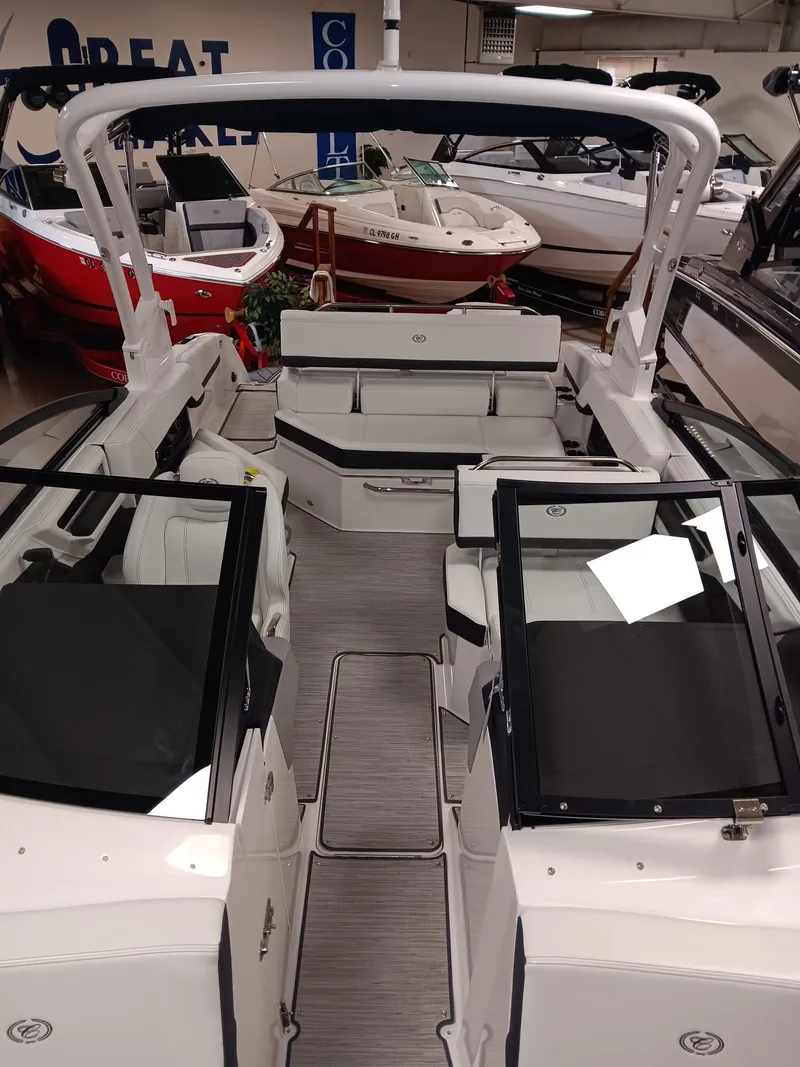 Slide: The Image of 2026 Cobalt R4 boat interior with sleek seating and modern design in showroom. - 11