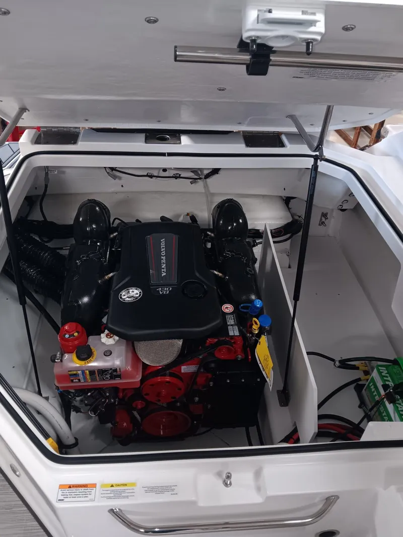 Slide: The Image of Engine compartment of a 2026 Cobalt R4 boat, featuring a powerful inboard motor. - 4
