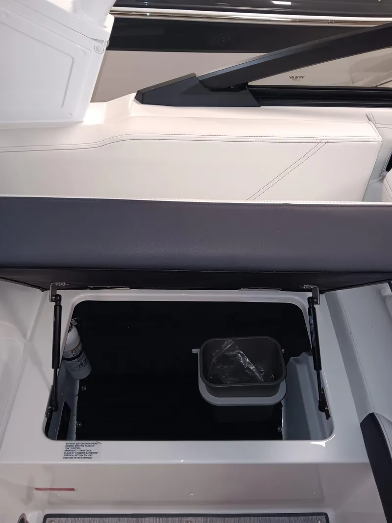 Slide: The Image of Open storage compartment in 2026 Cobalt R4 boat interior. - 6