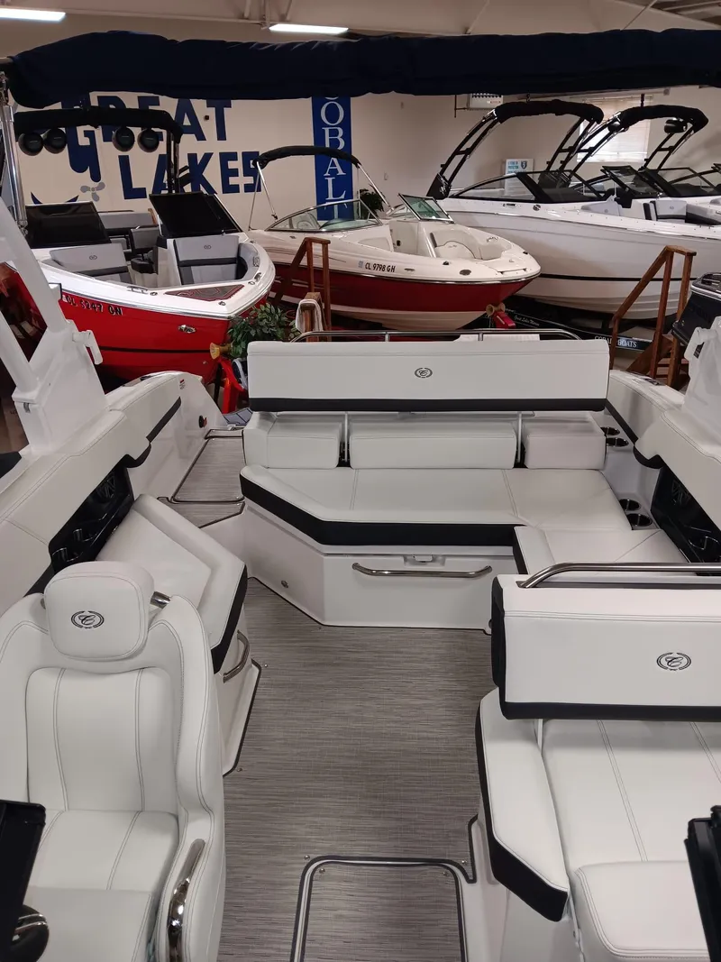 Slide: The Image of 2026 Cobalt R4 boat interior with luxurious white seating at Great Lakes showroom. - 8