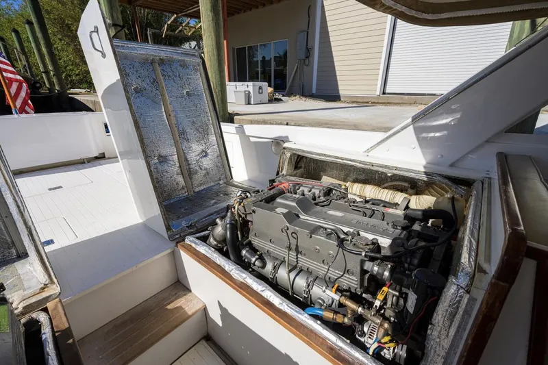 Slide: The Image of 1969 Bertram 31 Classic boat engine compartment, showcasing detailed mechanical components. - 25