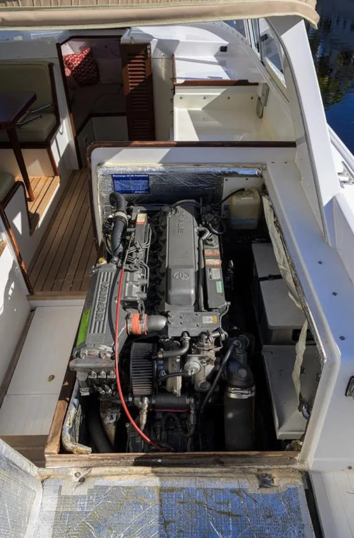 Slide: The Image of Engine compartment of a 1969 Bertram 31 Classic boat, showcasing detailed mechanical components. - 28