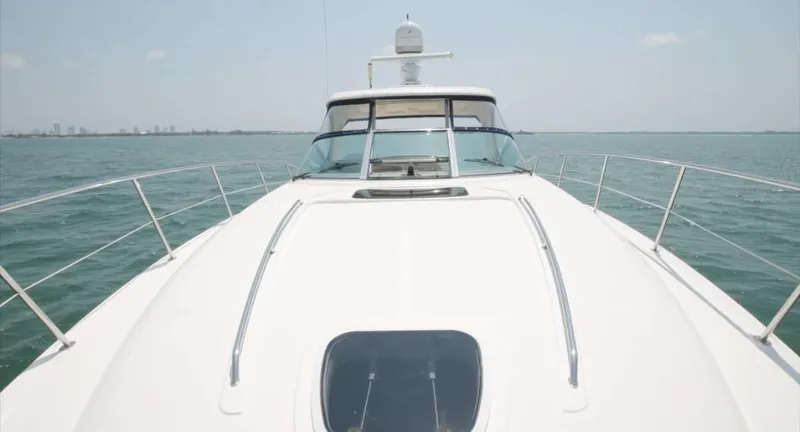 Slide: The Image of 2007 Sea Ray 40 Sundancer yacht cruising on open water, clear sky in background. - 10