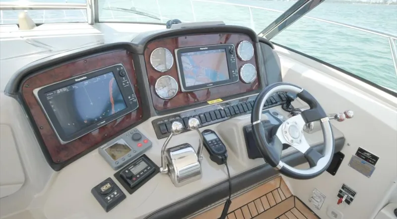 Slide: The Image of Helm of 2007 Sea Ray 40 Sundancer with navigation screens and controls. - 19