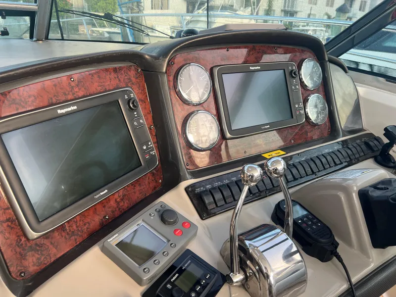 Slide: The Image of Control panel of a 2007 Sea Ray 40 Sundancer boat with navigation screens and gauges. - 20