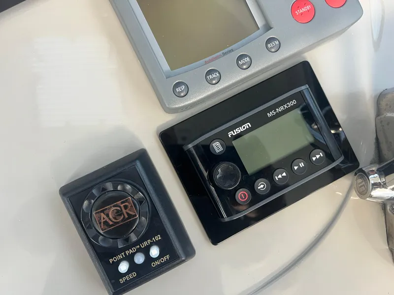 Slide: The Image of Control panel of a 2007 Sea Ray 40 Sundancer boat with navigation and audio systems. - 23