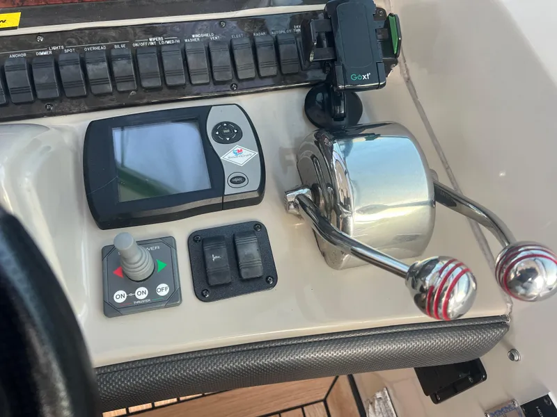 Slide: The Image of Control panel of a 2007 Sea Ray 40 Sundancer boat with throttle and navigation controls. - 24