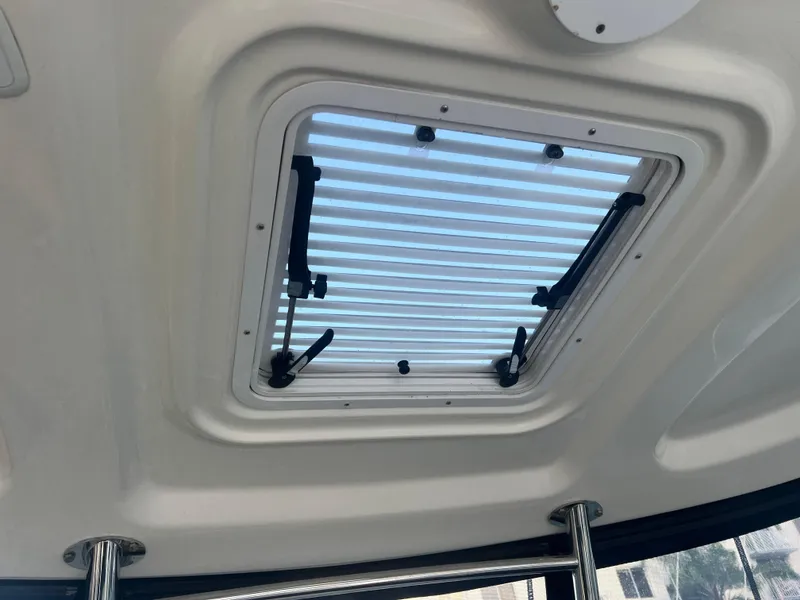 Slide: The Image of 2007 Sea Ray 40 Sundancer cabin skylight with adjustable handles. - 25