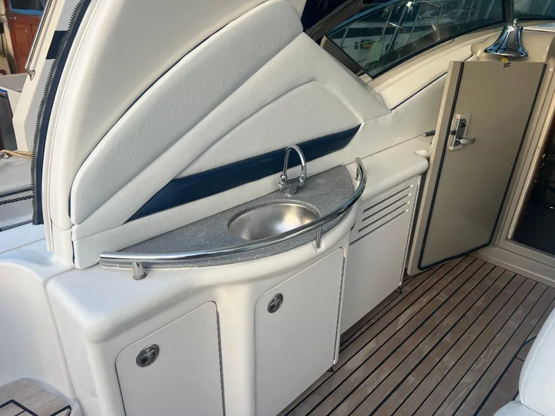 Slide: The Image of 2007 Sea Ray 40 Sundancer yacht interior with sink and storage cabinets. - 36