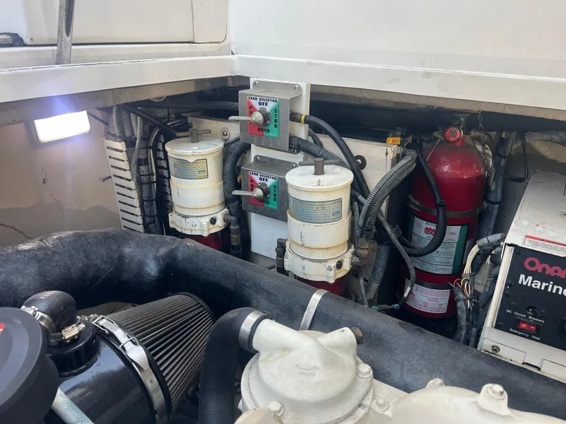 Slide: The Image of Engine compartment of a 2007 Sea Ray 40 Sundancer with filters, wiring, and fire extinguisher. - 39